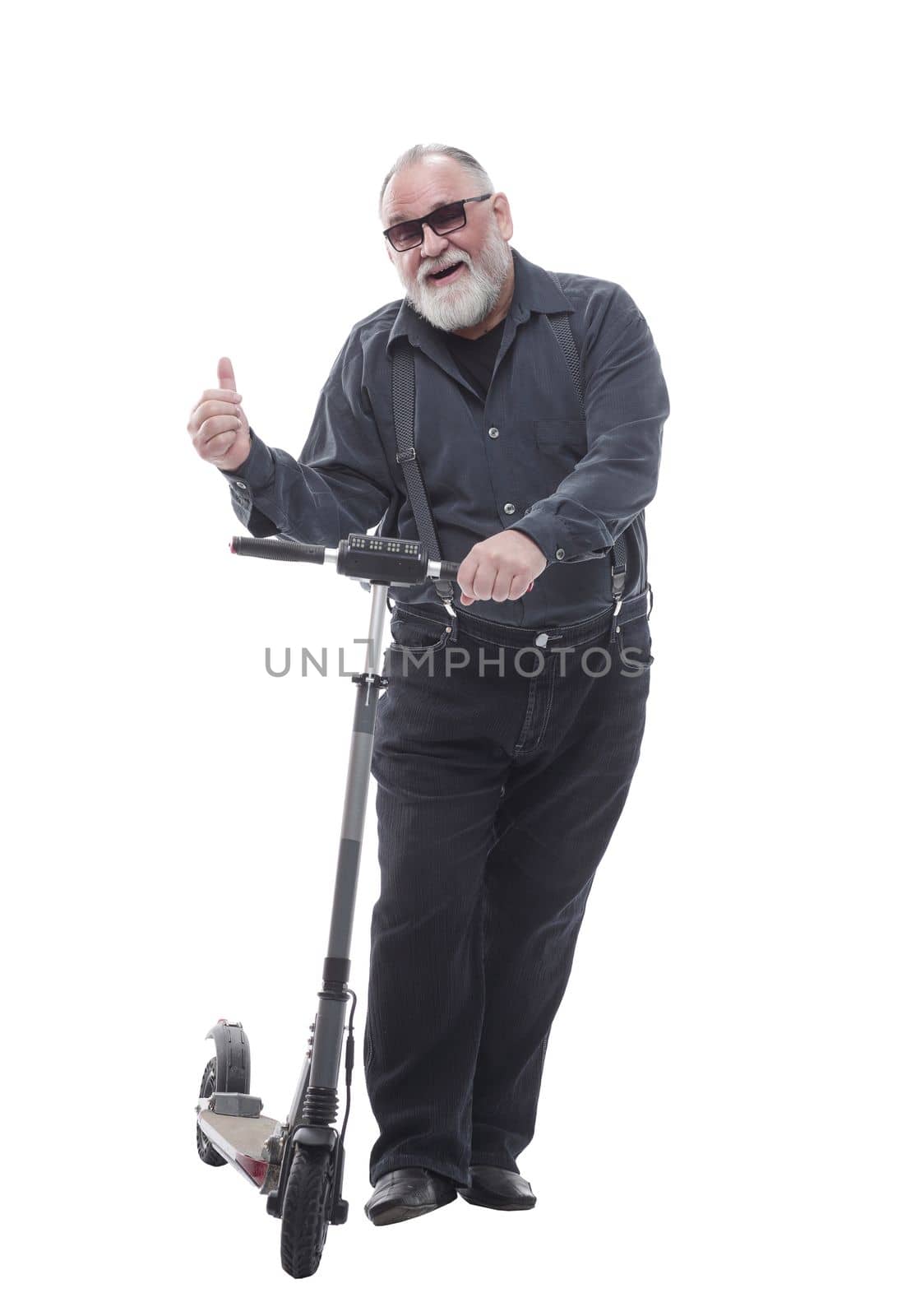 in full growth. elderly man standing on electric scooter. isolated on a white background
