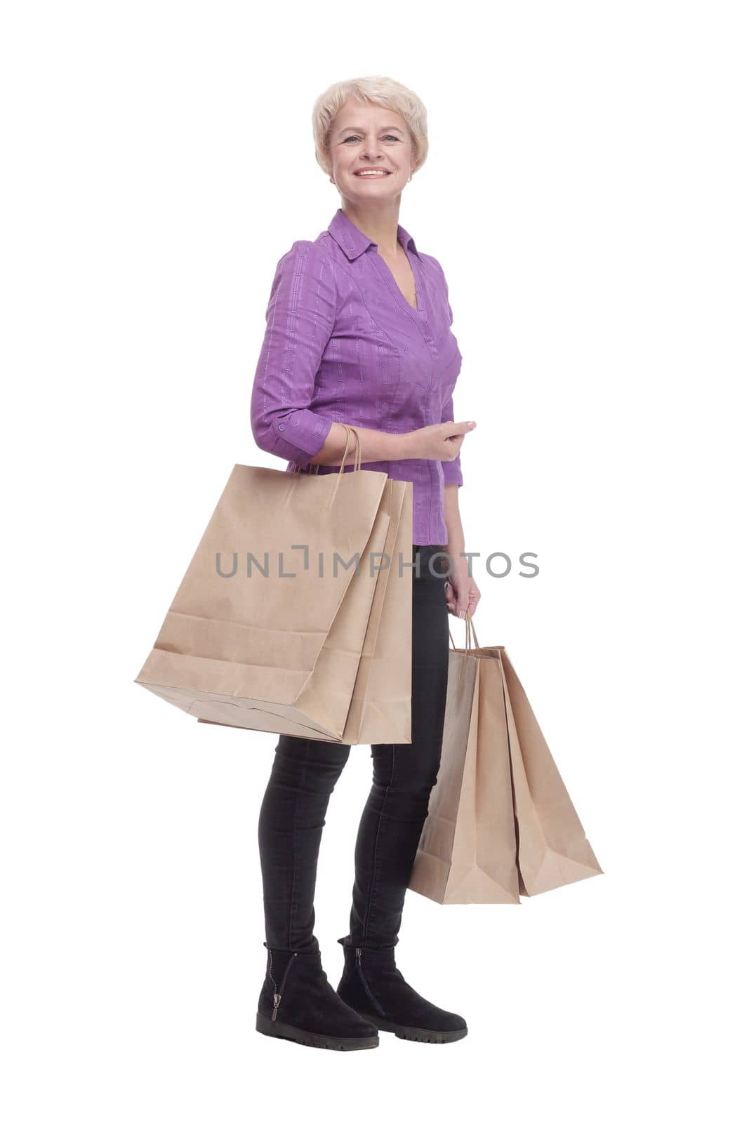in full growth. smiling casual woman with shopping bags. isolated on a white background.