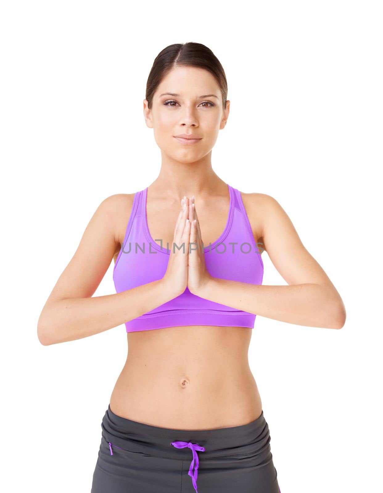 Staying healthy and focused. Studio portrait of an young woman in workout clothing holding her palms together in a meditative pose isolated on white. by YuriArcurs