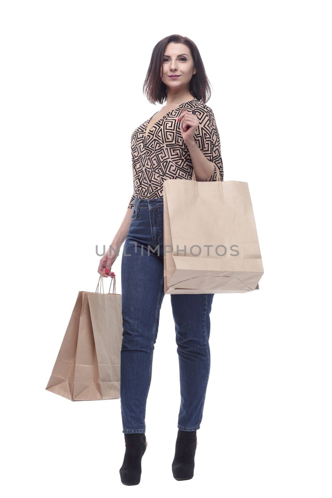 attractive young woman with shopping bags. isolated on a white background.