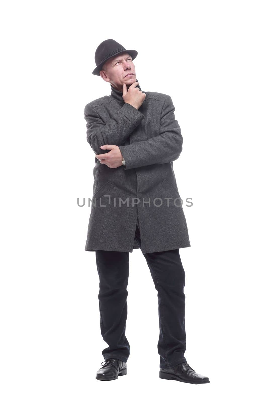in full growth. intelligent man in a hat and autumn coat. isolated on a white background.
