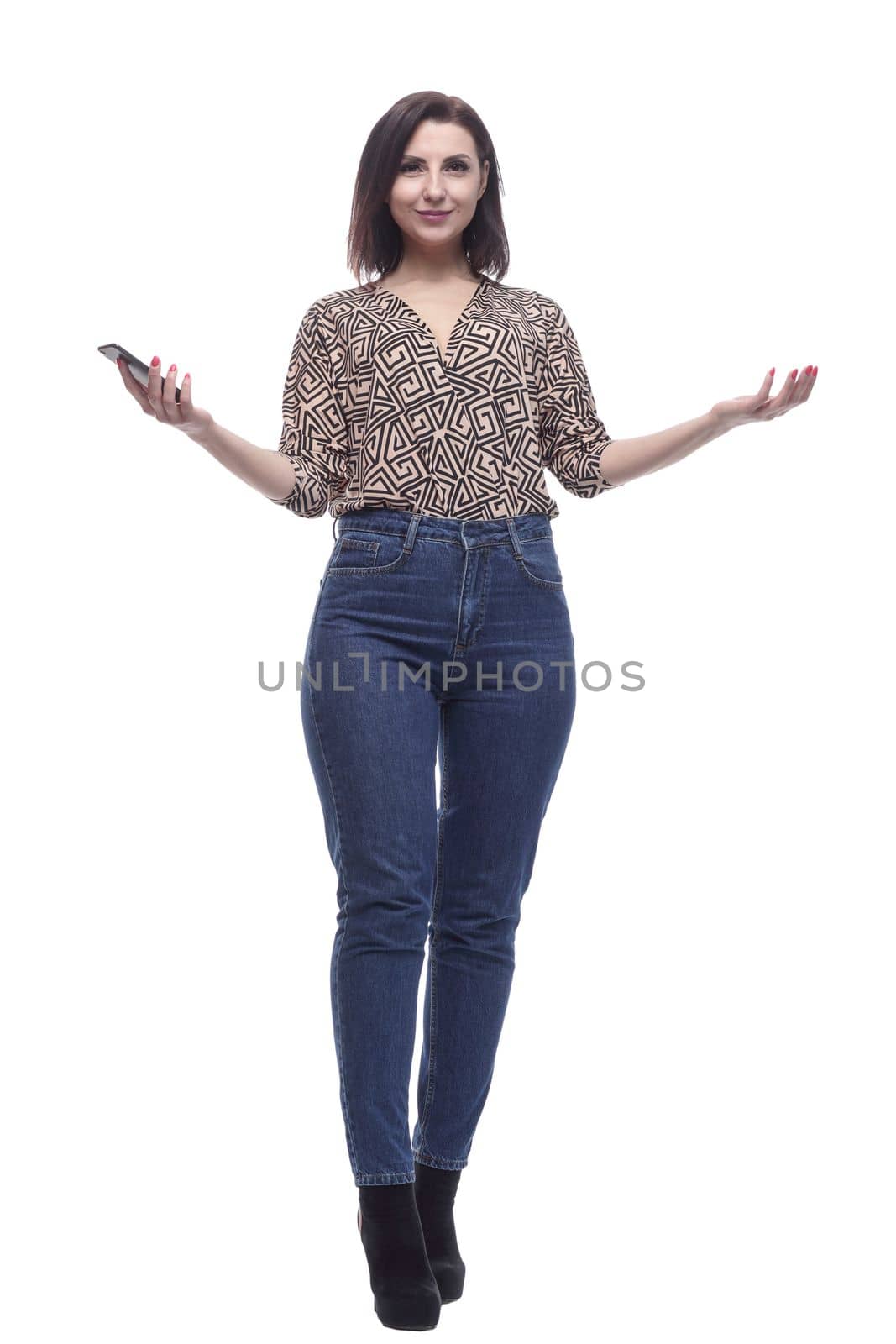 in full growth. attractive young woman with a smartphone. isolated on a white background.
