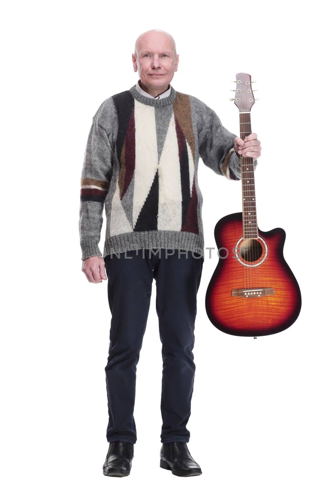 full-length. mature man with guitar in hand looking at you. isolated on a white background.