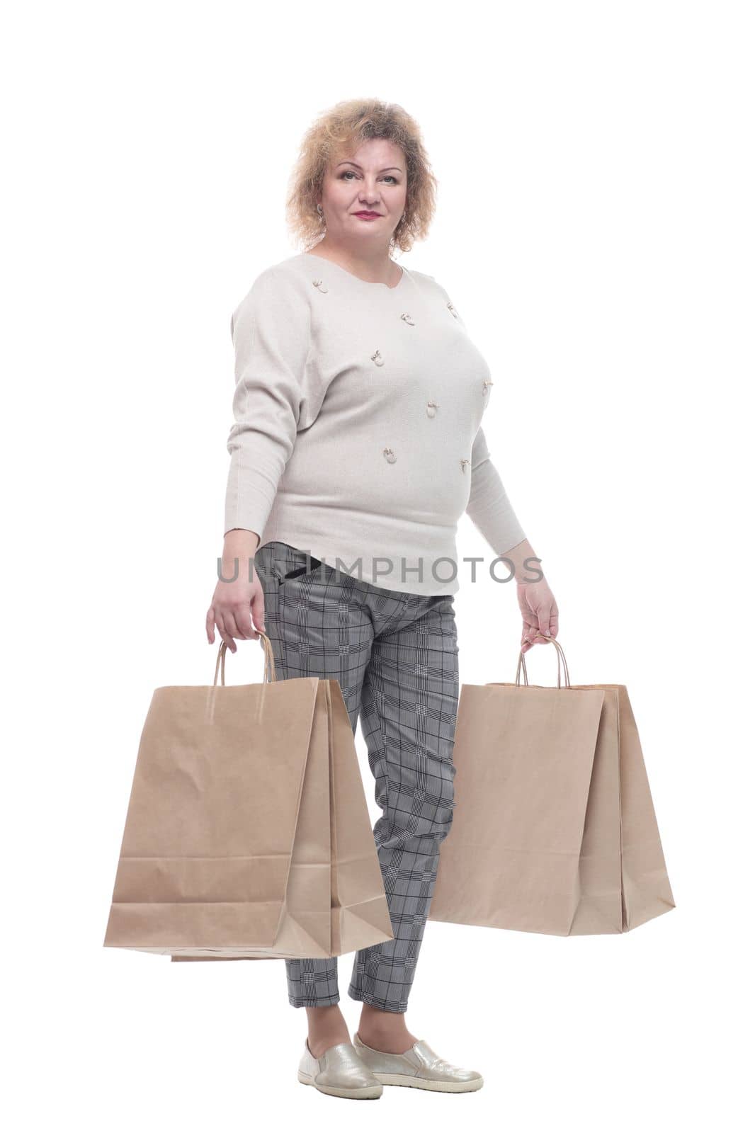 full-length. casual adult woman with shopping bags. isolated on a white background.