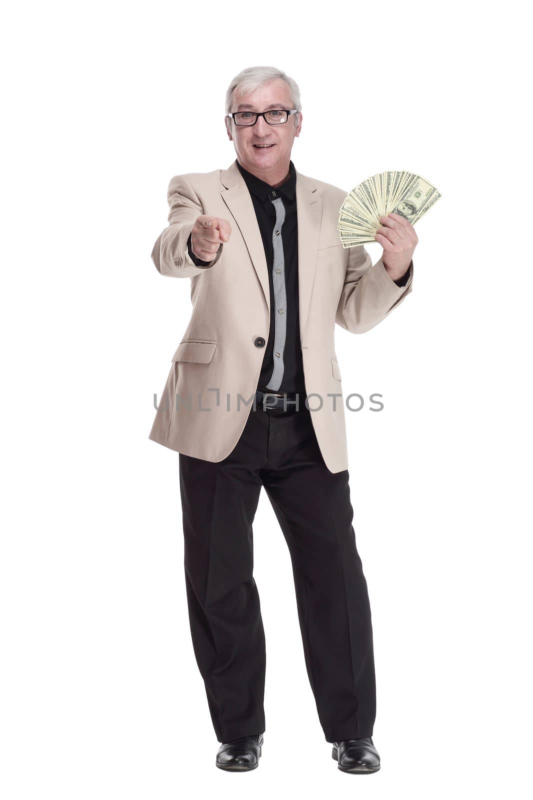 in full growth. happy intelligent man with banknotes. isolated on a white background.