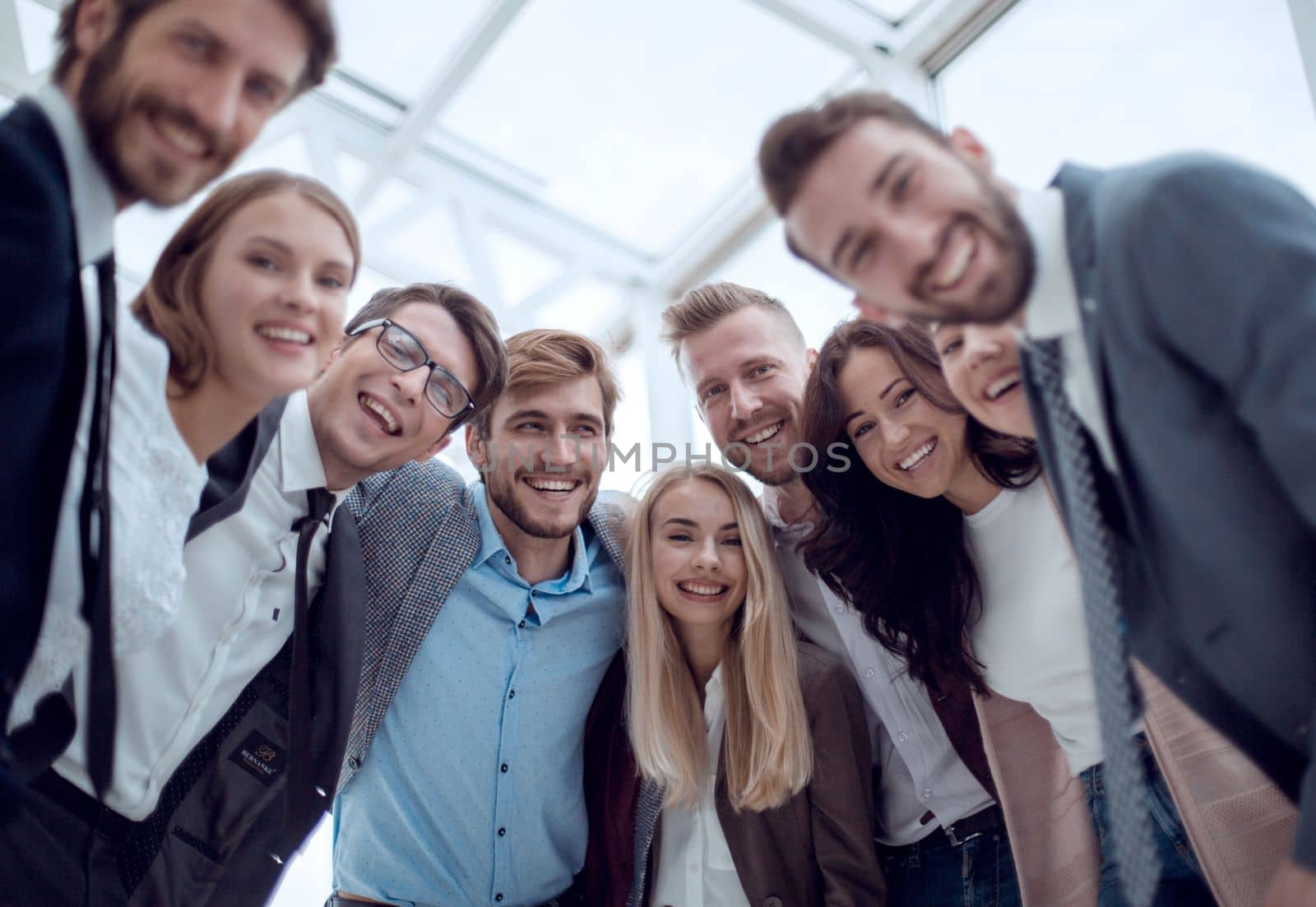 close up. group of smiling young people looking at the camera . by asdf
