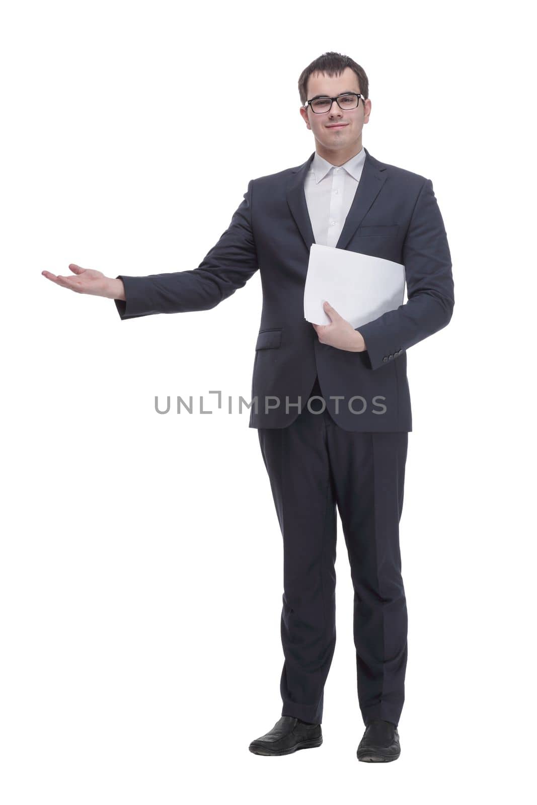 Business man in glasses and formalwear is readin a document while standing against a white background. Isolated portrait