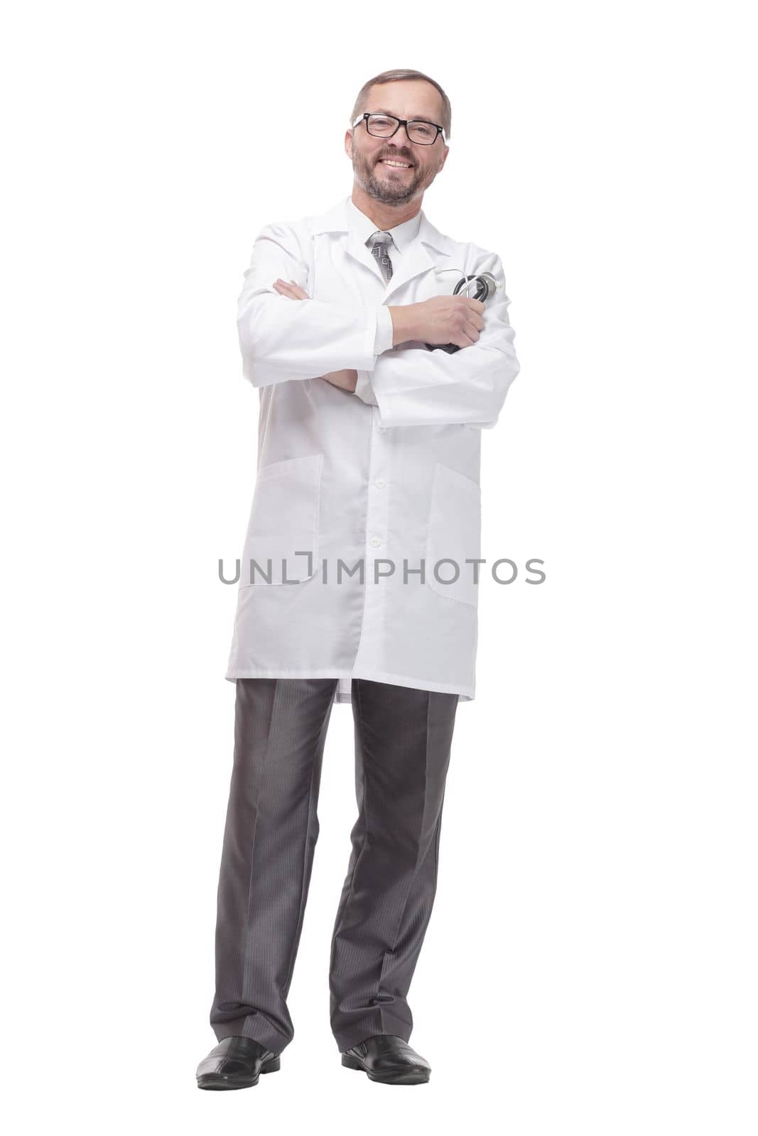 in full growth. smiling doctor with a stethoscope in his hands . isolated on a white background.