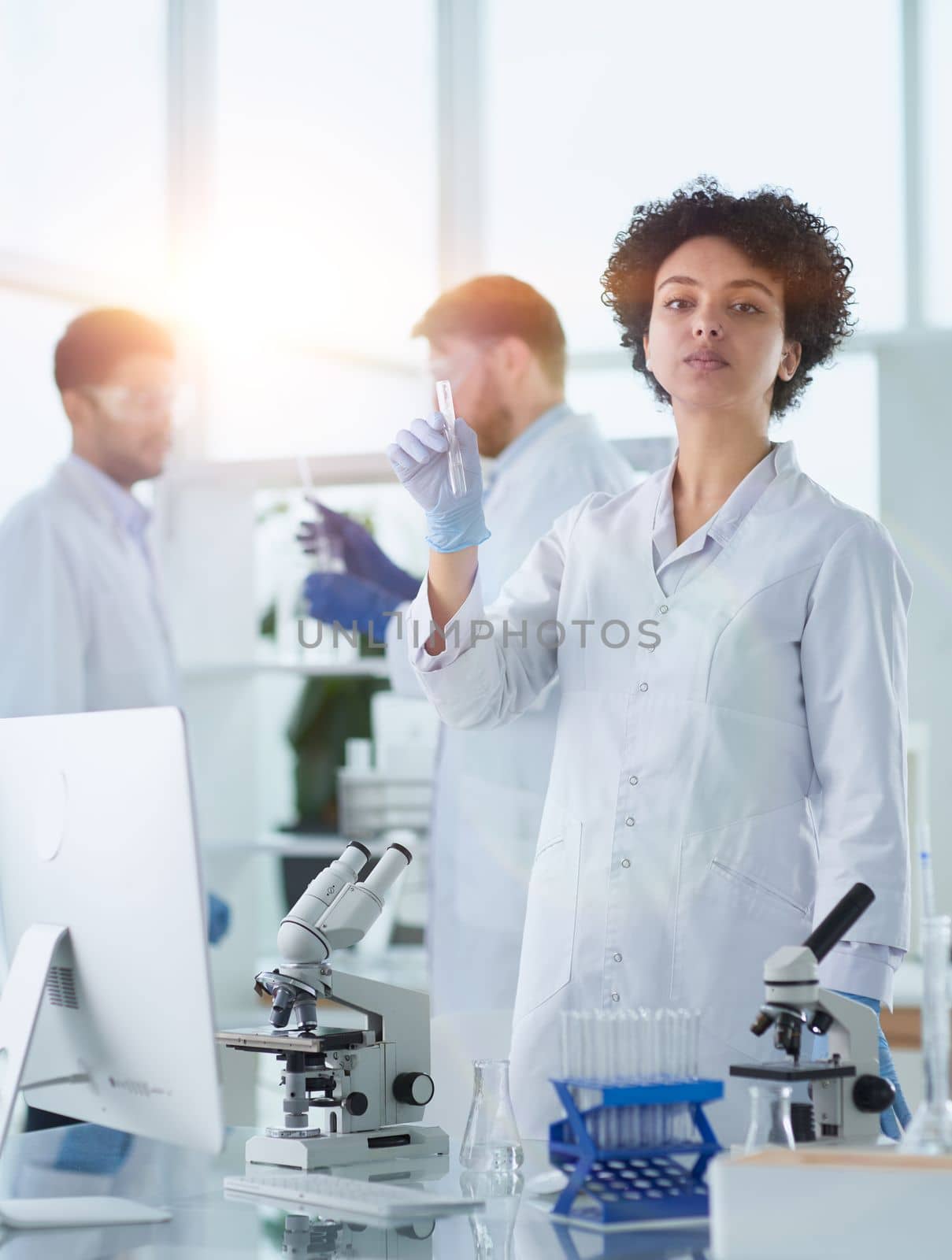 Scientists smiling together in lab