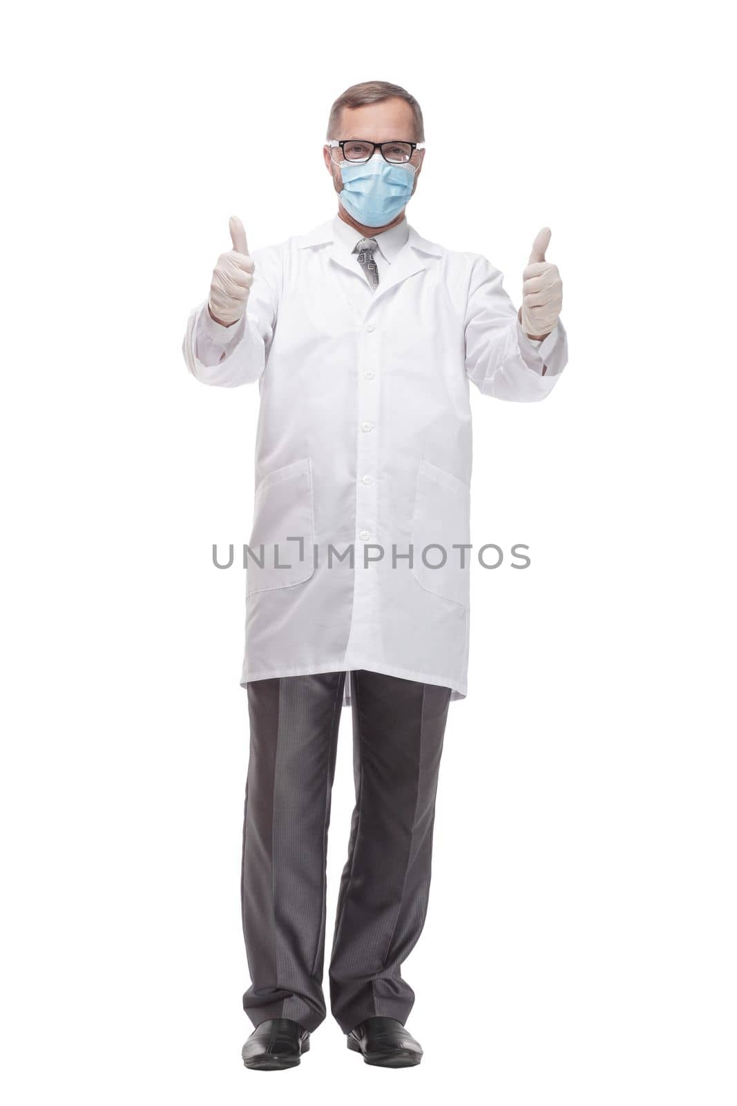 in full growth. medic in protective mask and gloves . isolated on a white background.