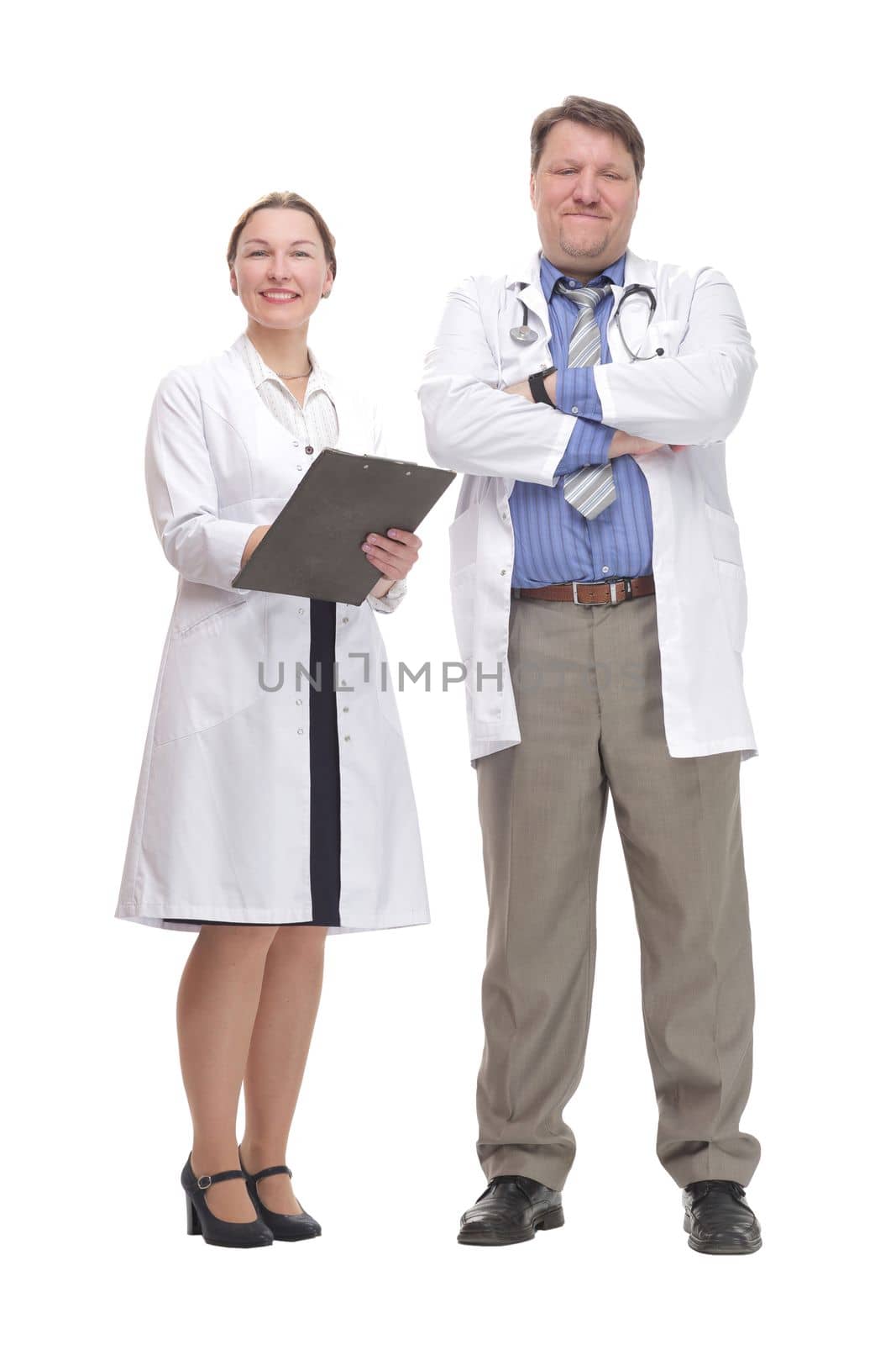 in full growth. medical colleagues standing together.isolated on a white background.