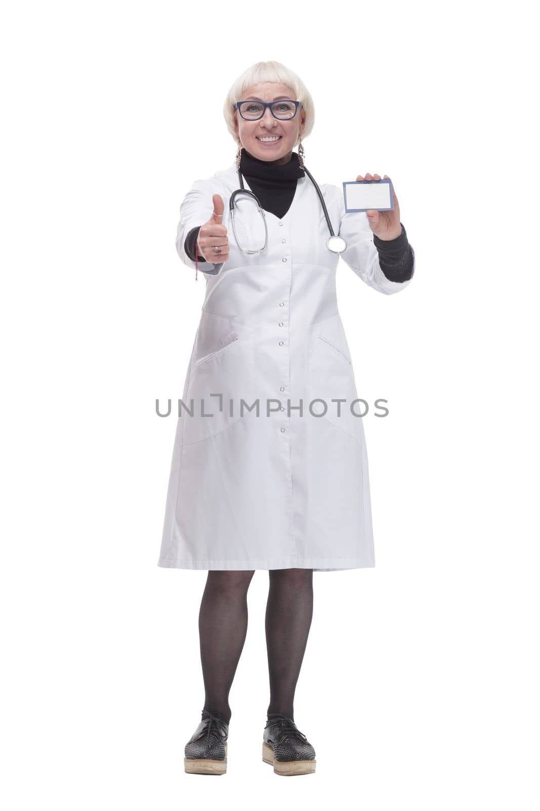 in full growth. medical doctor woman showing her visiting card. isolated on a white background.