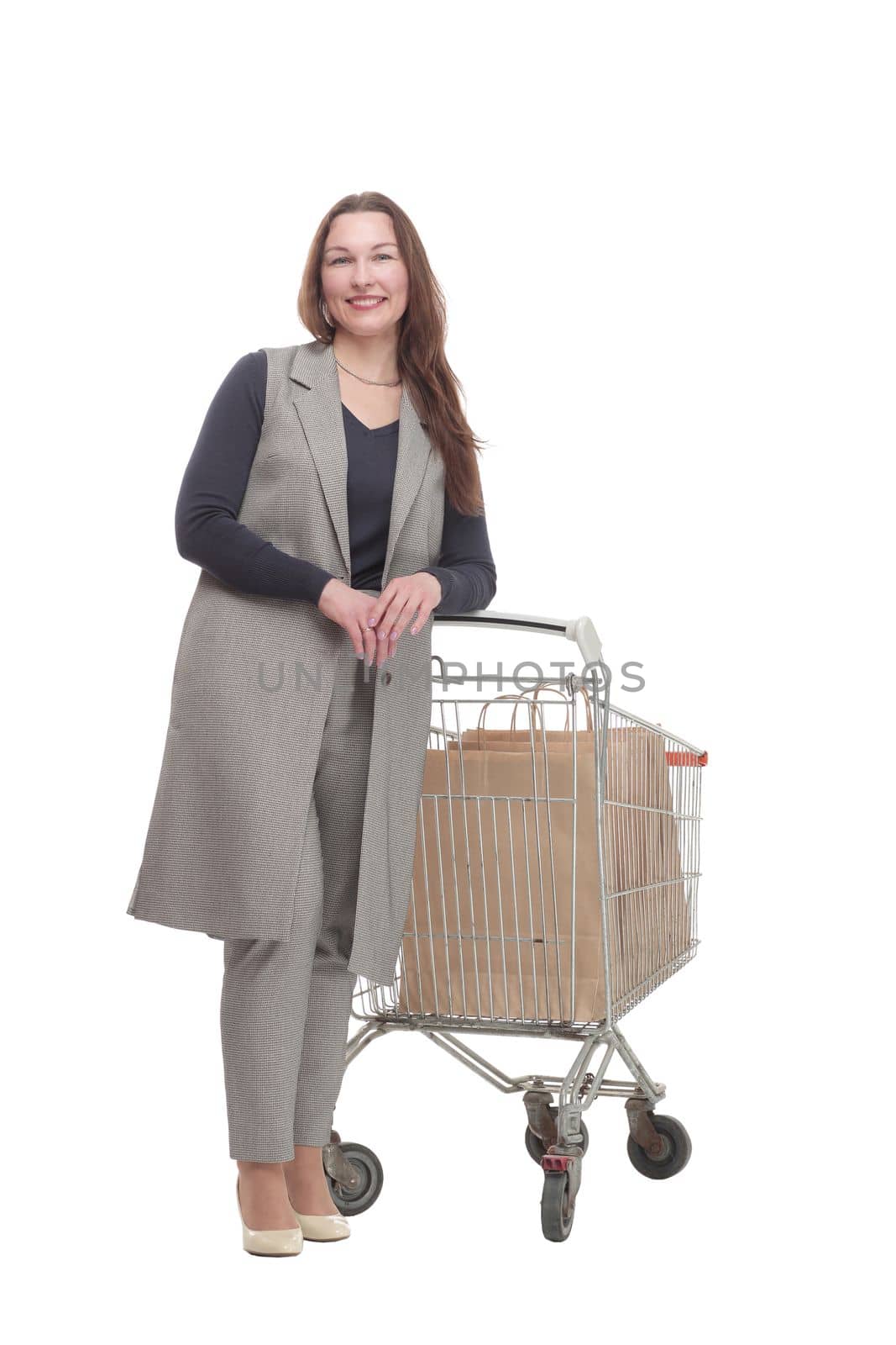 in full growth. elegant woman with a shopping cart.isolated on a white background.