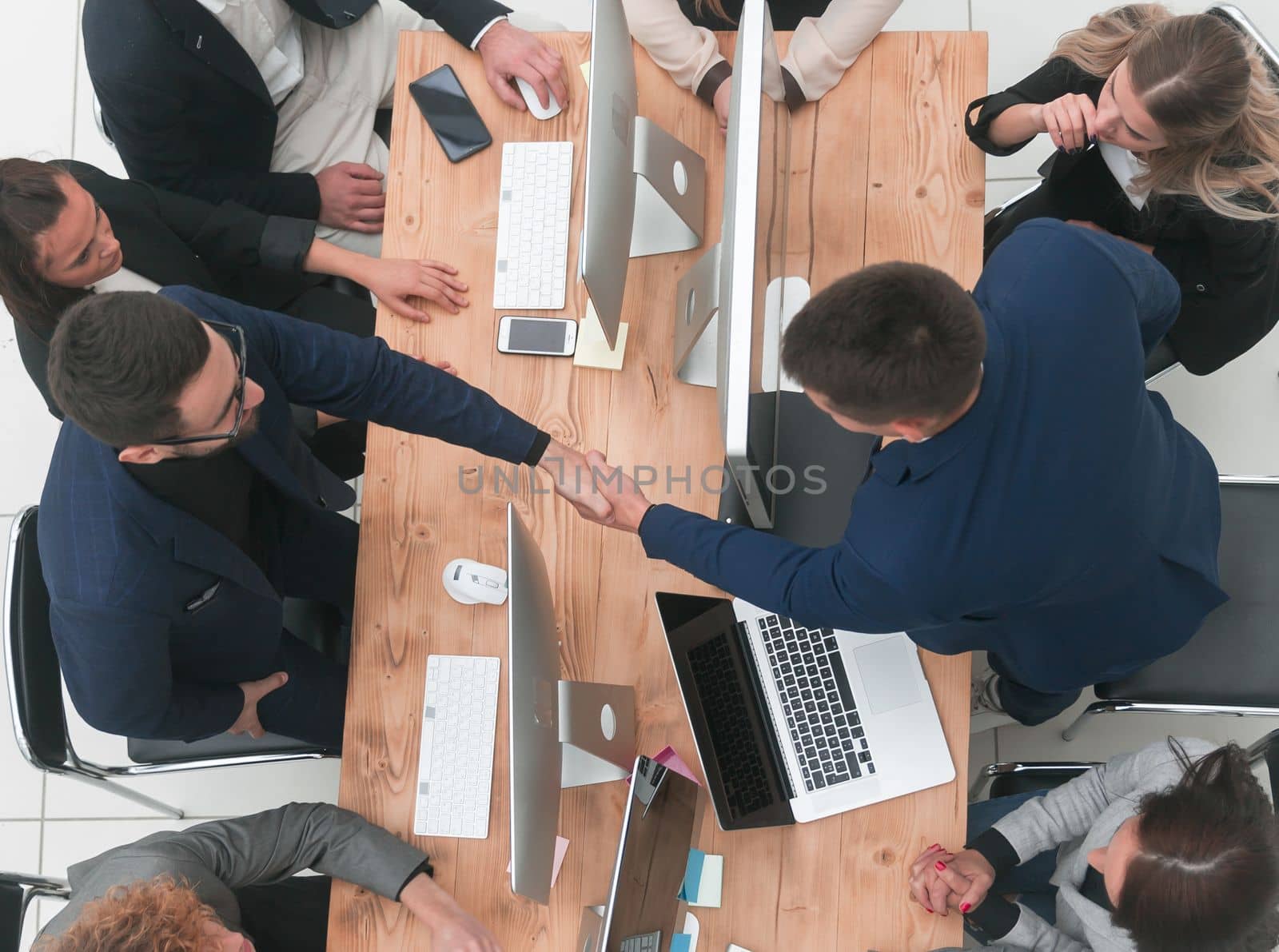 top view. business colleagues supporting each other with a handshake.