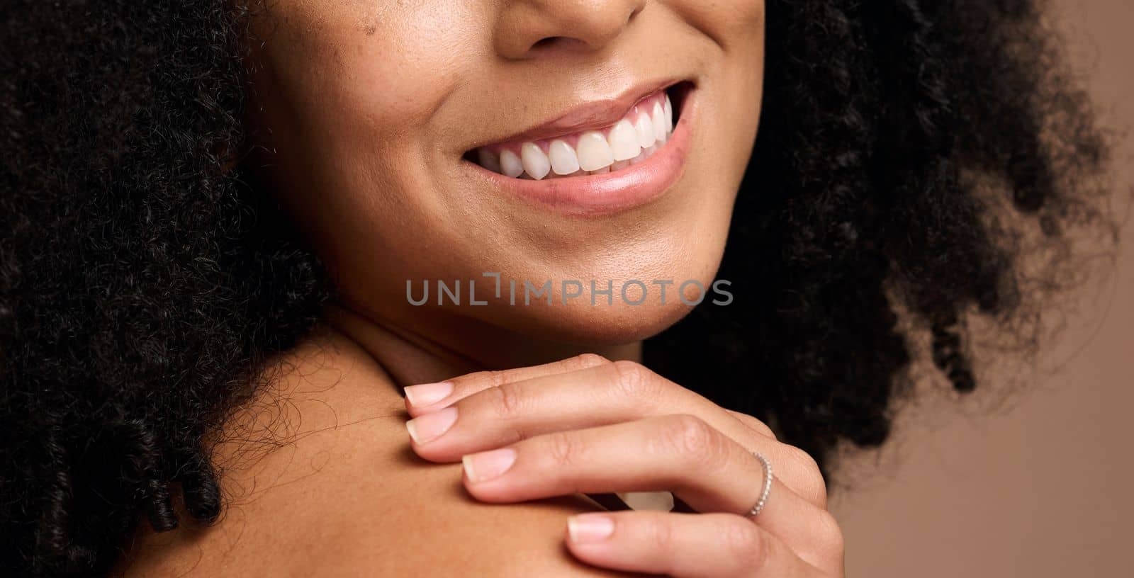 Dental, face beauty and teeth of black woman in studio isolated on a brown background. Makeup, skincare and cosmetics of happy female model with veneers, teeth whitening and invisalign for wellness