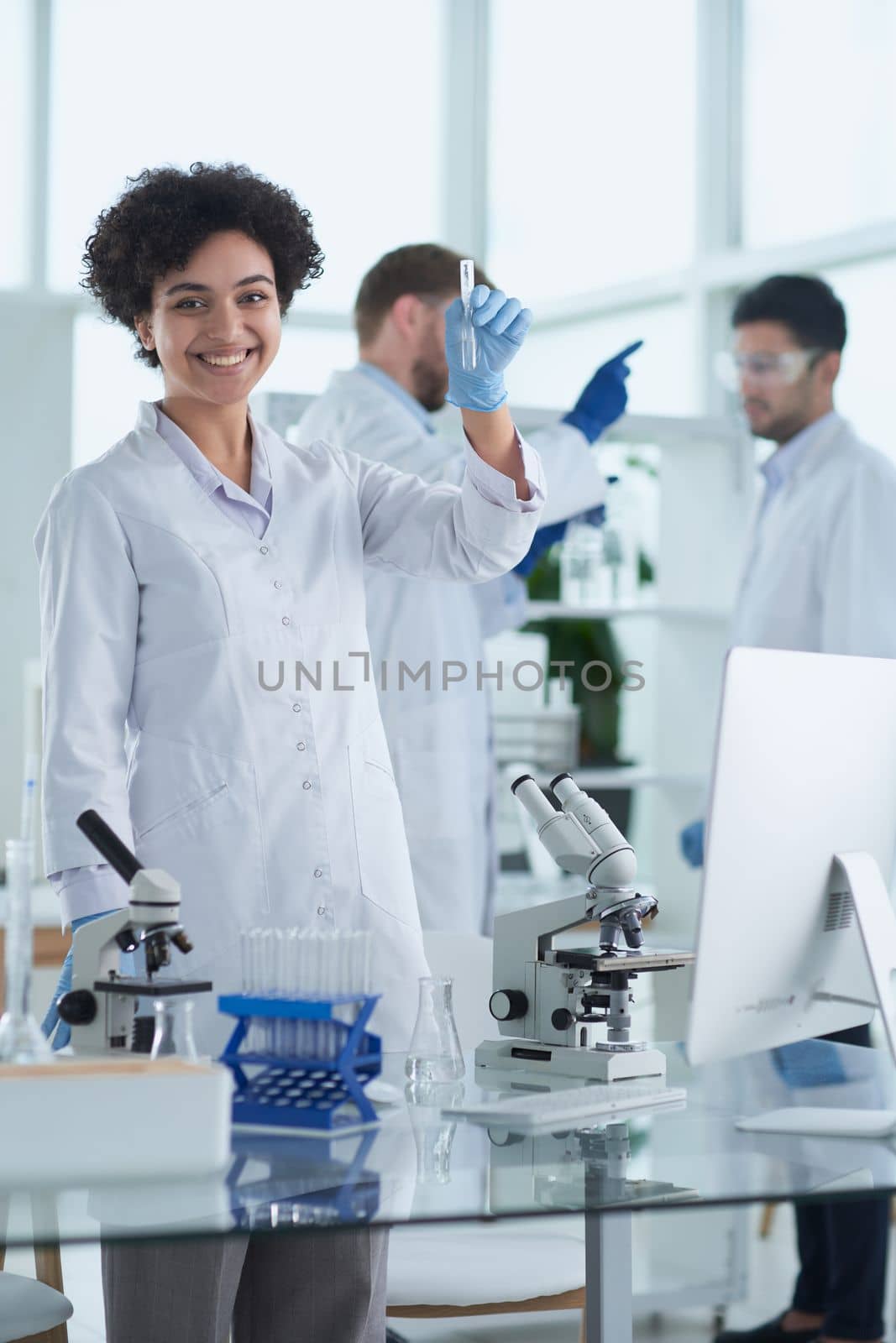 Scientists smiling together in lab