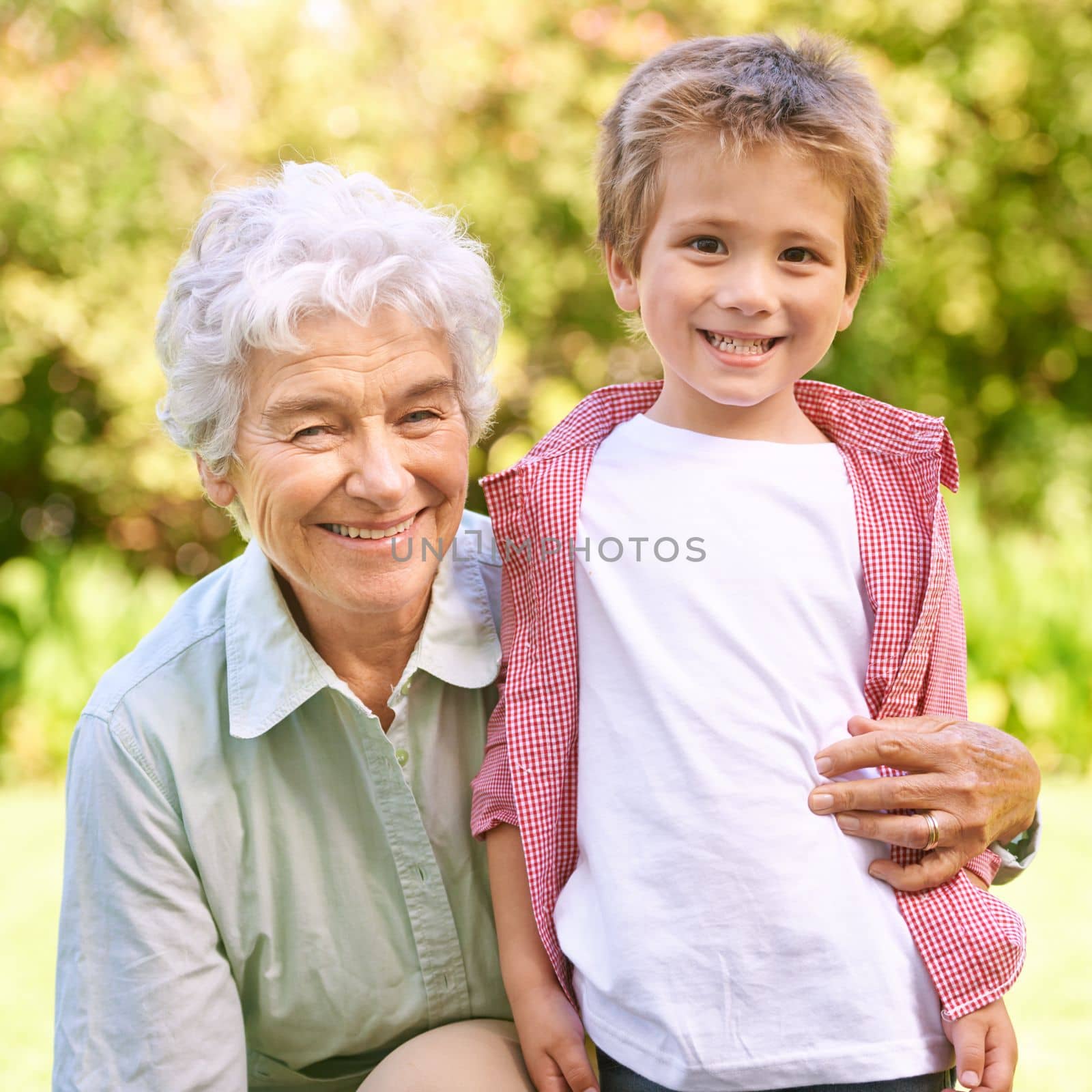 Me and my grandma. Portrait of a little boy with his grandmother in the outdoors