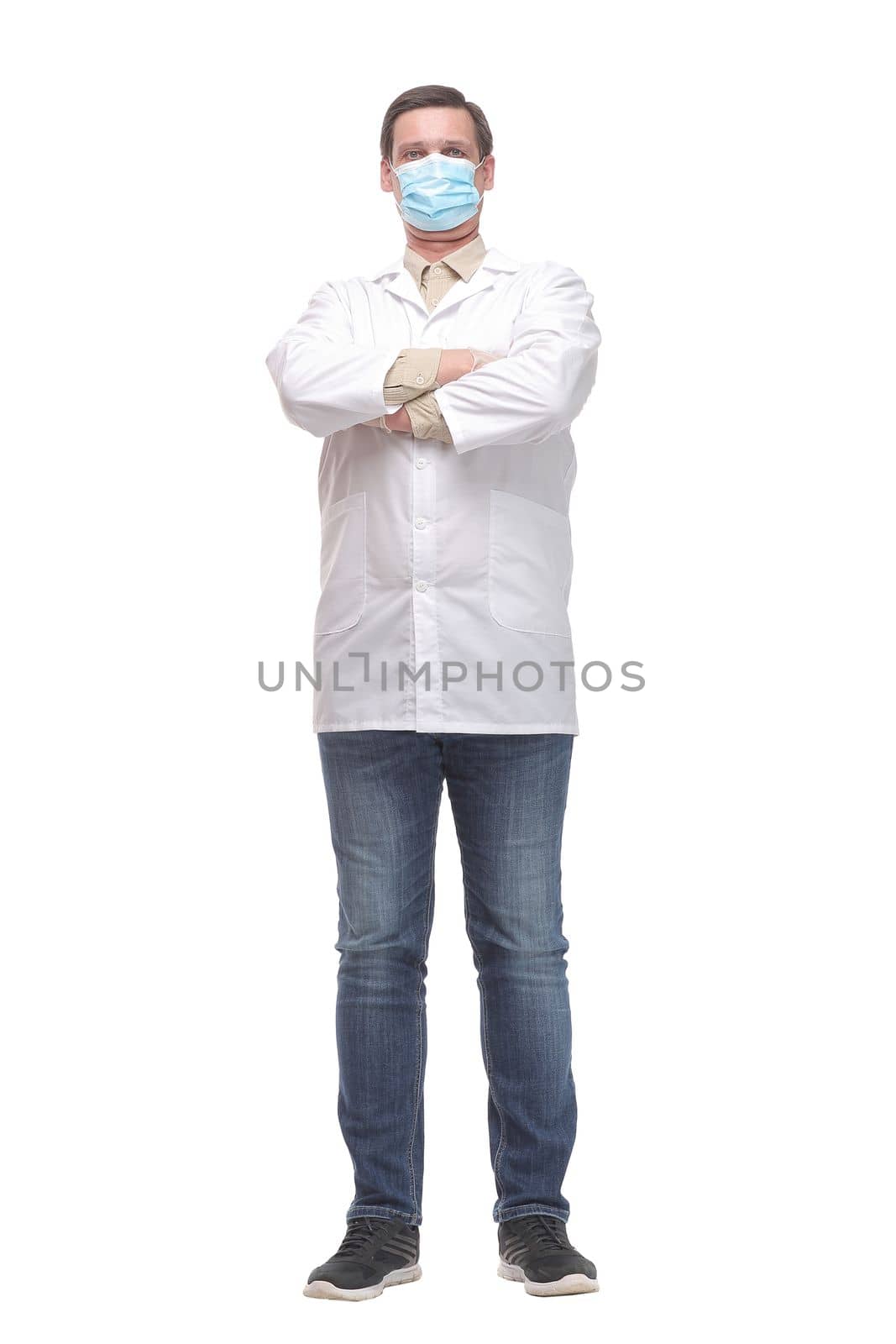 Portrait of caucasian doctor using protective gloves and mask by asdf