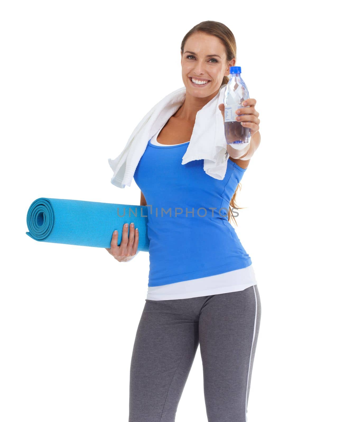 Keep water at the ready - Health tips. Fit young woman holding a pilates mat and water bottle with a smile - isolated on white