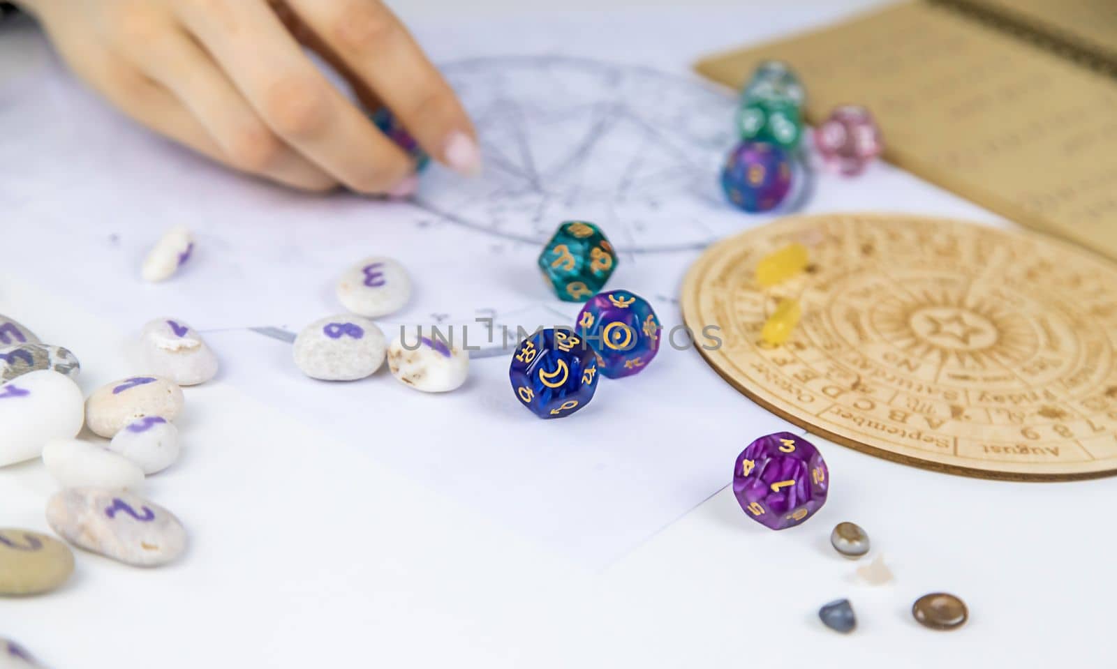 Woman numerologist astrologer counts numbers. Selective focus. People.