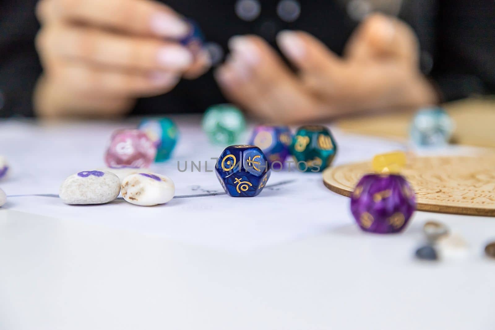 Woman numerologist astrologer counts numbers. Selective focus. People.
