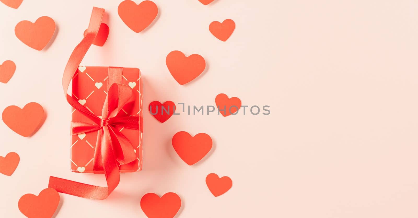 Happy Valentine's Day Background. Top view beautiful hearts and gift boxes on pastel pink background surprise your loved with space for text, mother's day, concept banner holiday