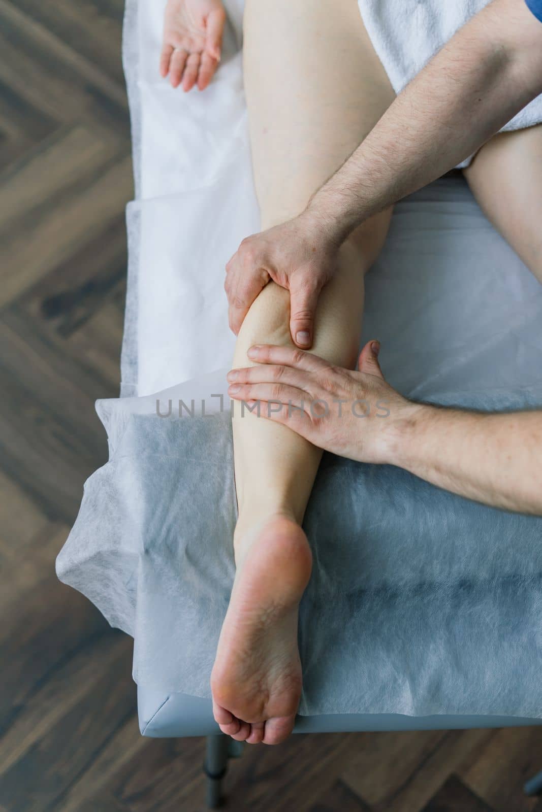 Anti-cellulite foot massage for a fat woman. Concept of personal care, weight loss, diet. Close-up. by Zelenin