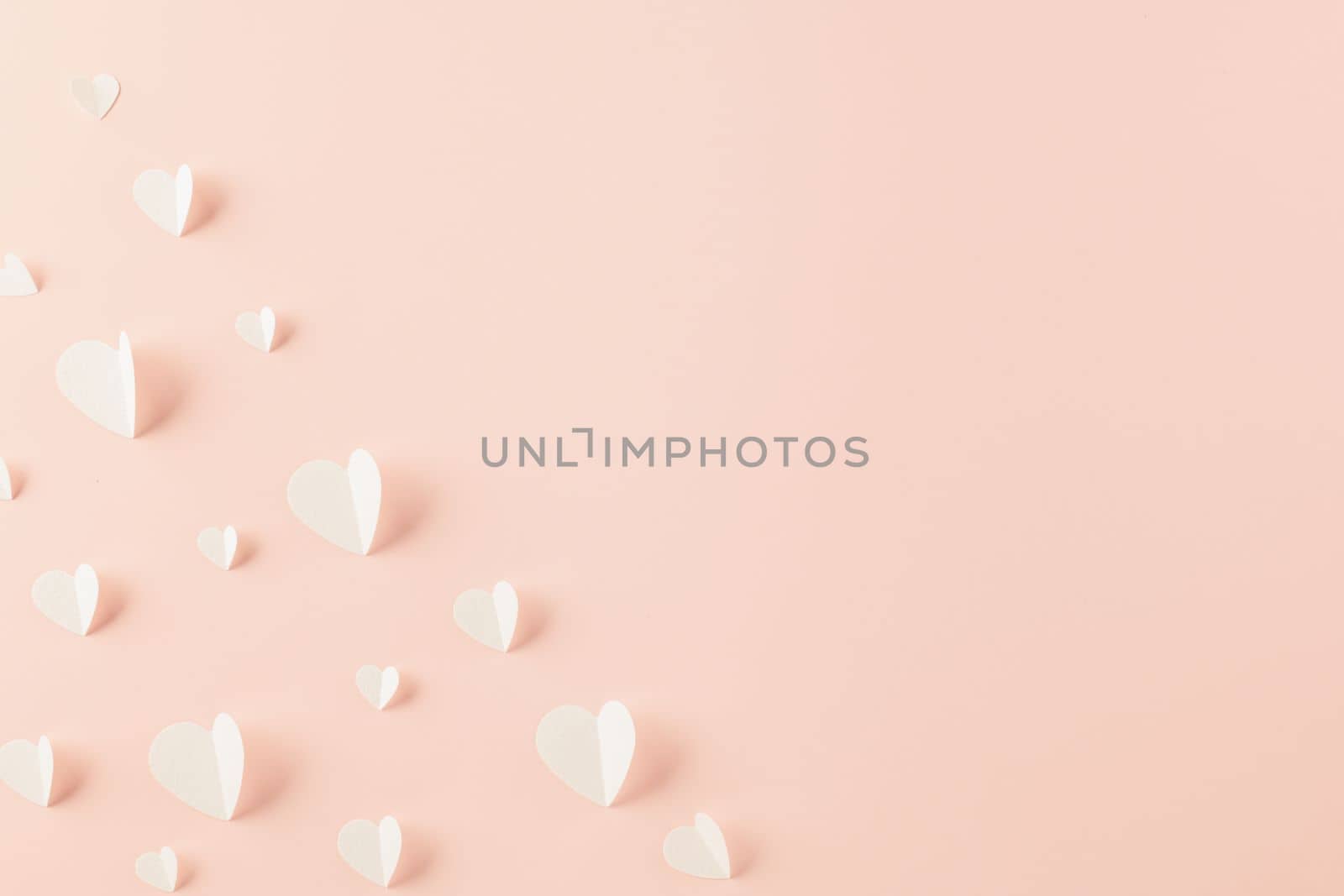 Happy Valentines Day background. Top view flat lay of paper elements cutting white hearts shape flying on pink background with copy space, Happy Mother's Day, Banner template design of holiday