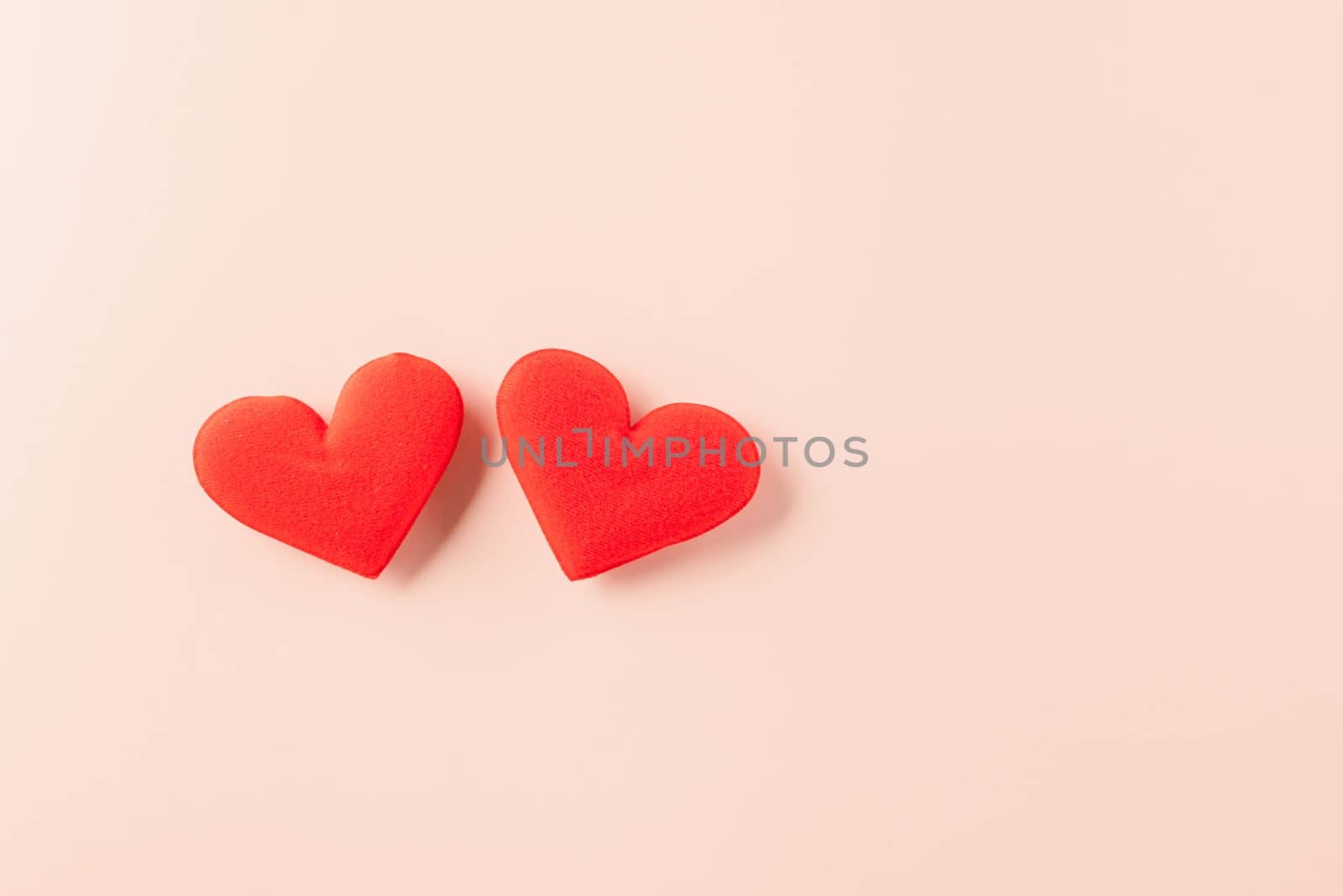 Happy Valentines Day background. Top view flat lay of twored hearts shape on pink background with copy space, Valentine day concept, Banner template design of holiday
