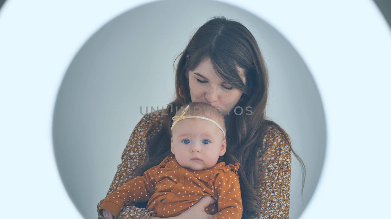 A loving mother with her child against a sulfur background