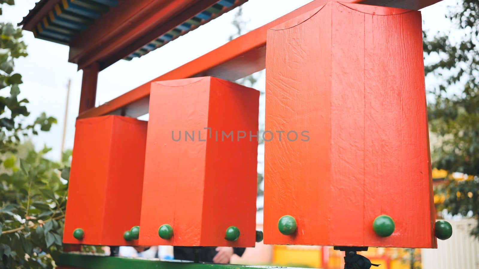 Rotation of the red prayer drums outside the Buddhist temple