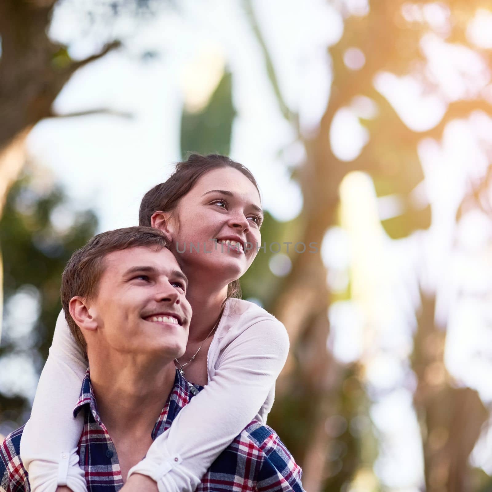 The future looks bright from where theyre standing. a happy young couple enjoying a piggyback ride outside