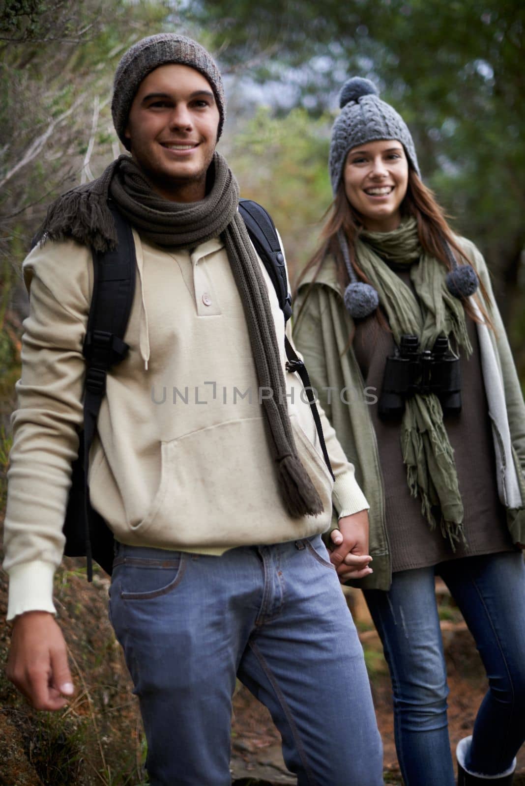 Exploring nature. A happy young couple spending time together outdoors