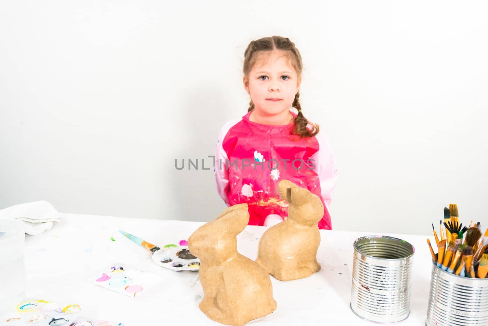 Little girl working on her art project for distance learning at home during COVID-19 pendemic.