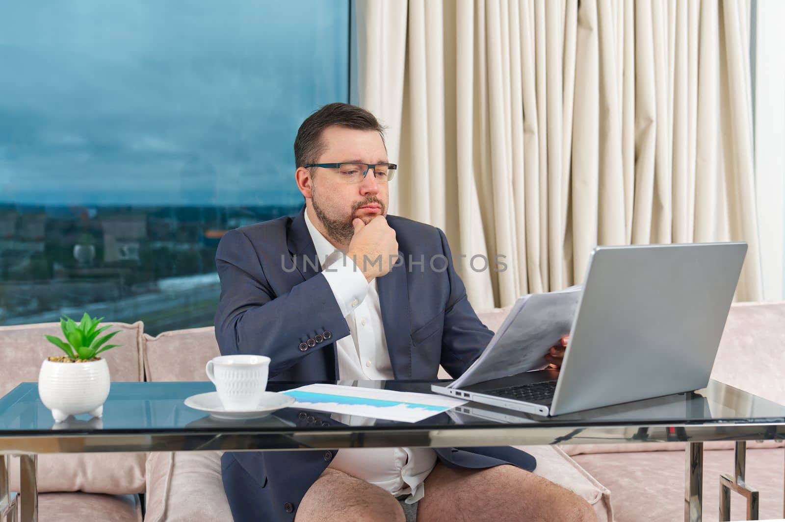 Man in suit without pants working online. home office, video conference, self-isolation concept by PhotoTime