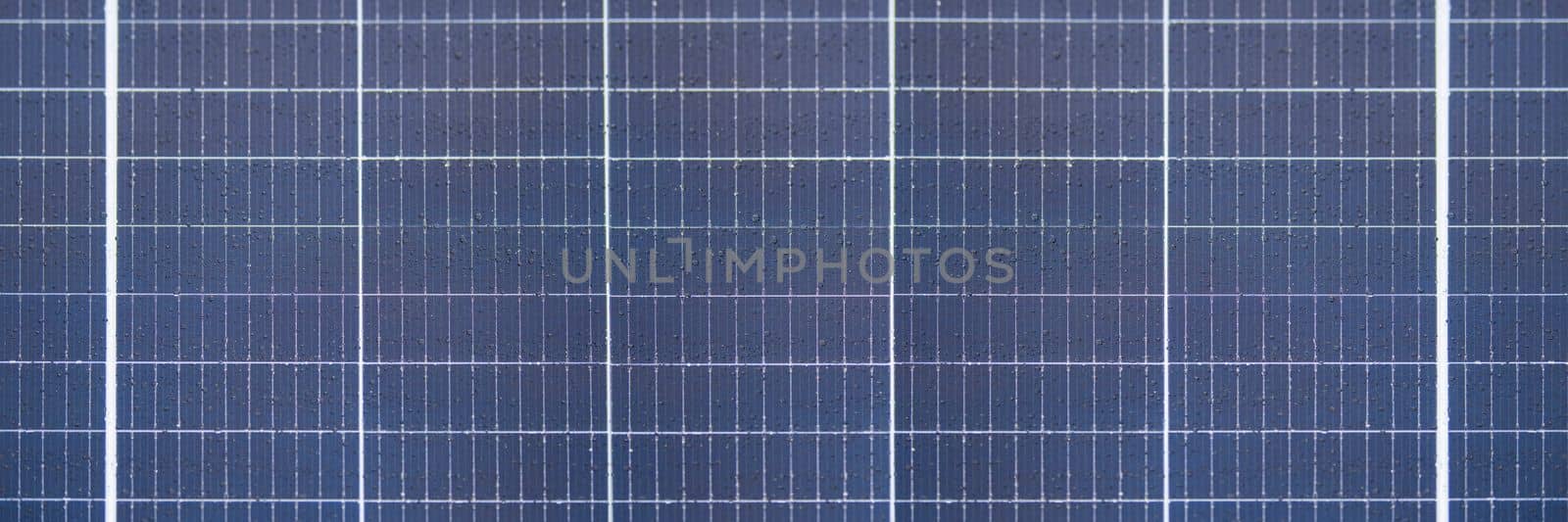 Solar panel texture with raindrops, waterproof solar panel modules, top view, as background or texture by SERSOL