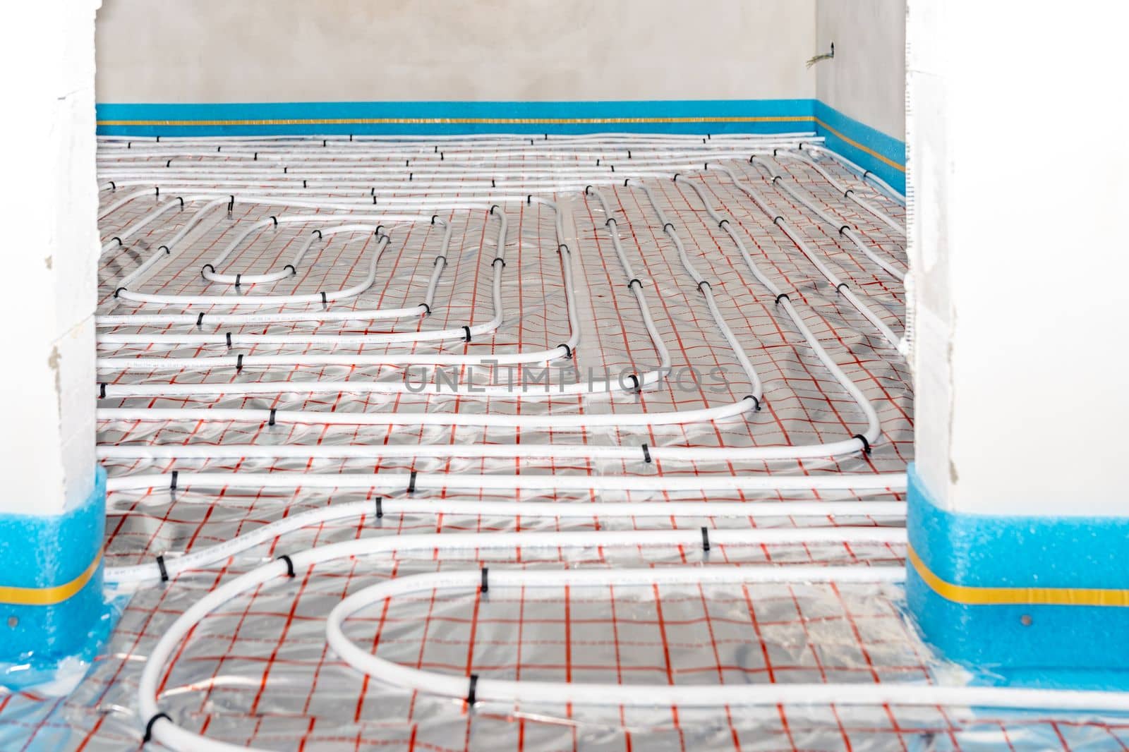 underfloor heating in the room on the construction site.
