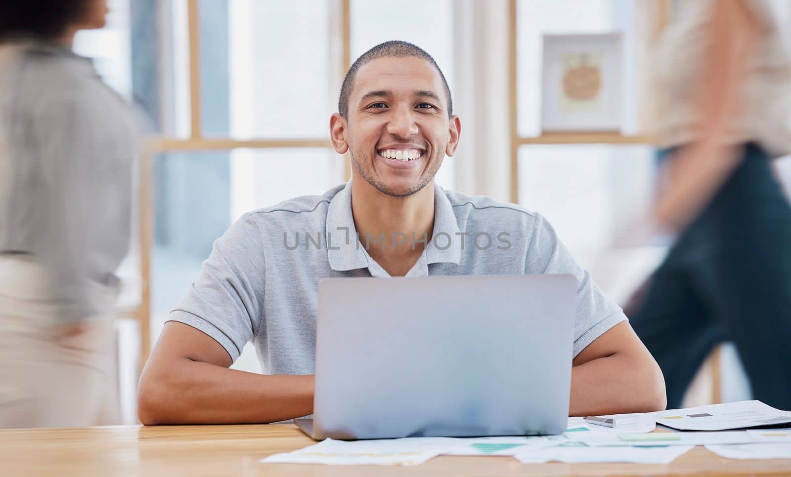 Planning, busy office and person on laptop, email management and portrait for career mission in startup. Happy worker, black man or employee smile, working on computer and documents in fast workplace.