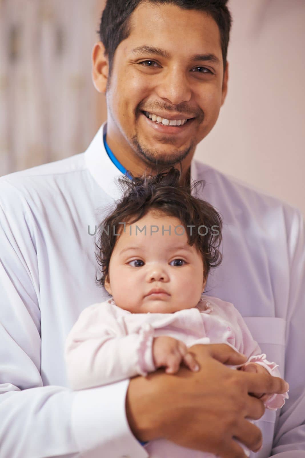Shes the reason for the smile on my face. a father cradling his little baby girl