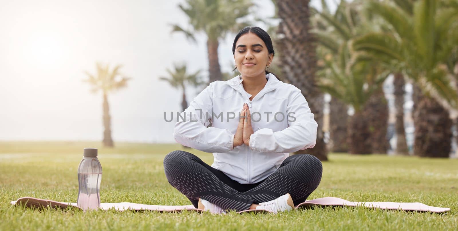 Fitness, meditation and yoga with woman in park for peace, zen and breathing exercise. Relax, energy and freedom with girl training on grass for health, wellness and spiritual summer lifestyle.
