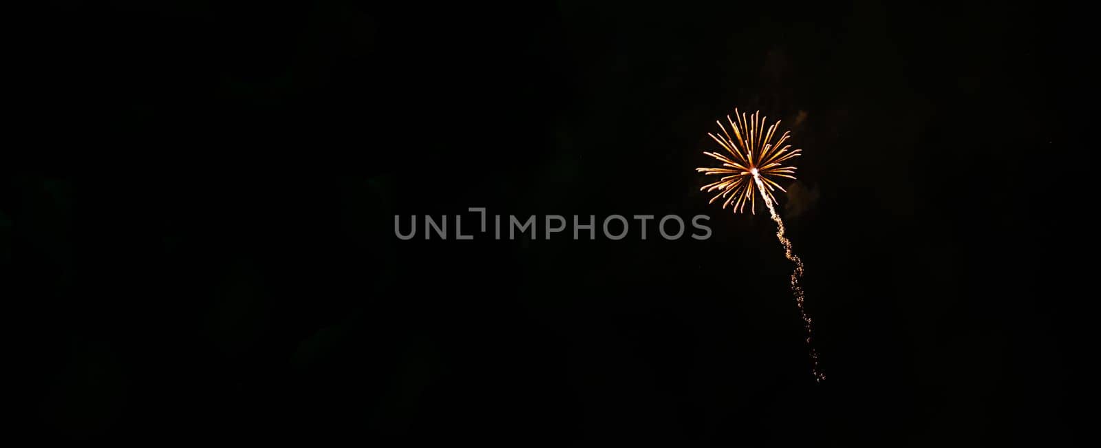 one small fireworks in the night sky. by andre_dechapelle
