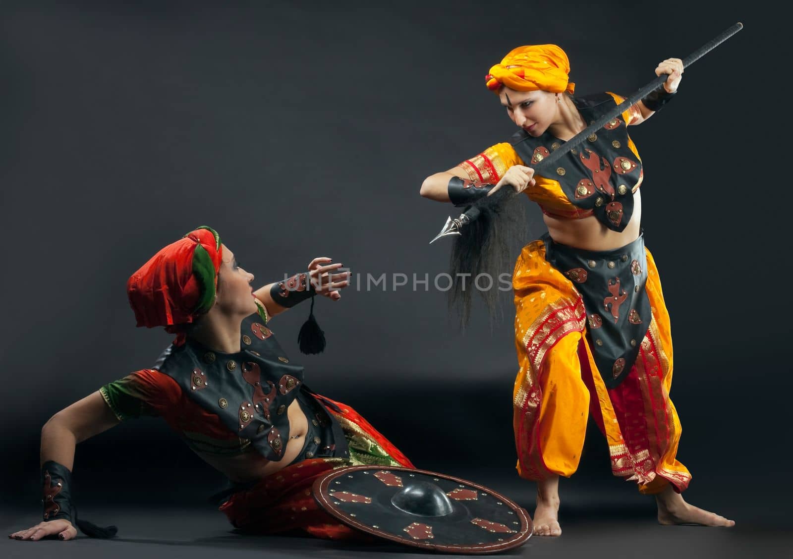 Two woman fight with spear and shield - arabia theme