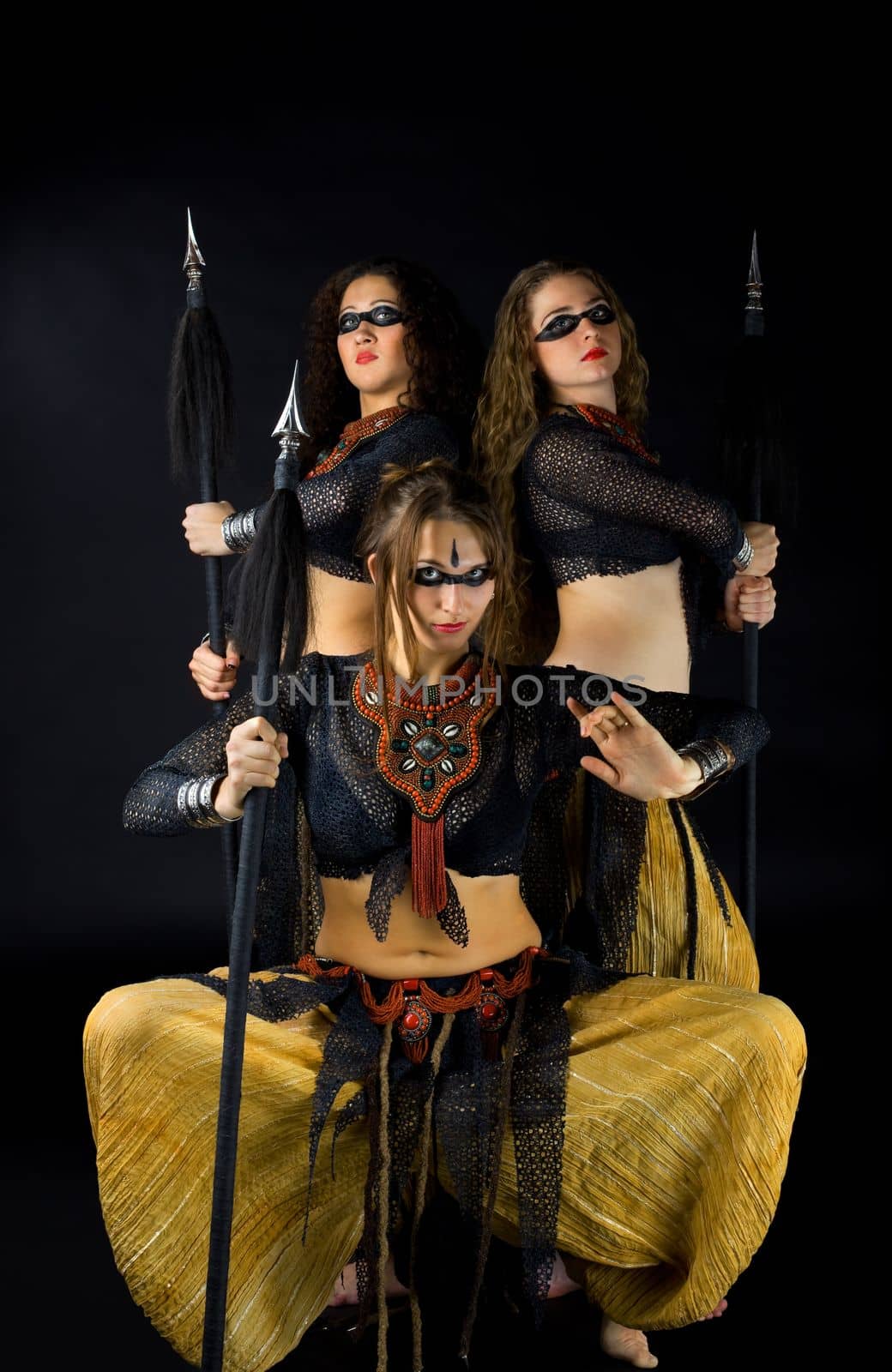Three woman with spear - traditional arabia costume