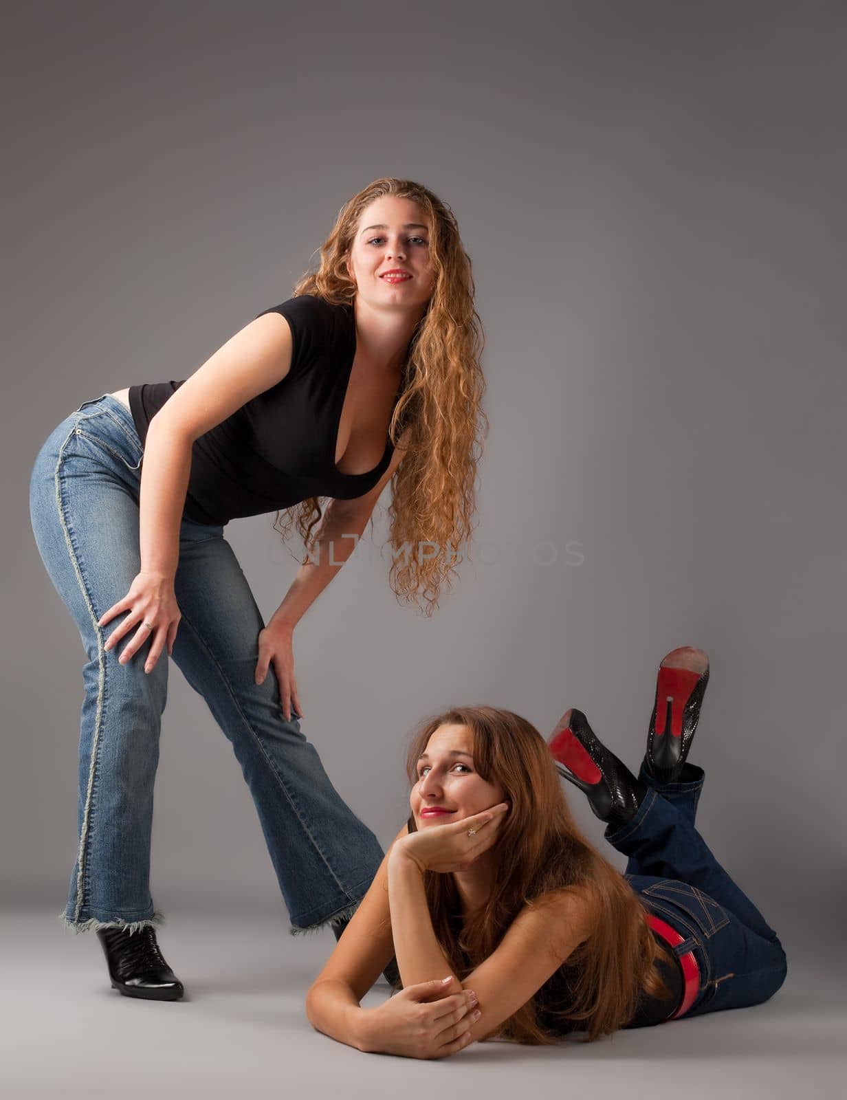 Two beauty woman look at you - contemporary jeans style