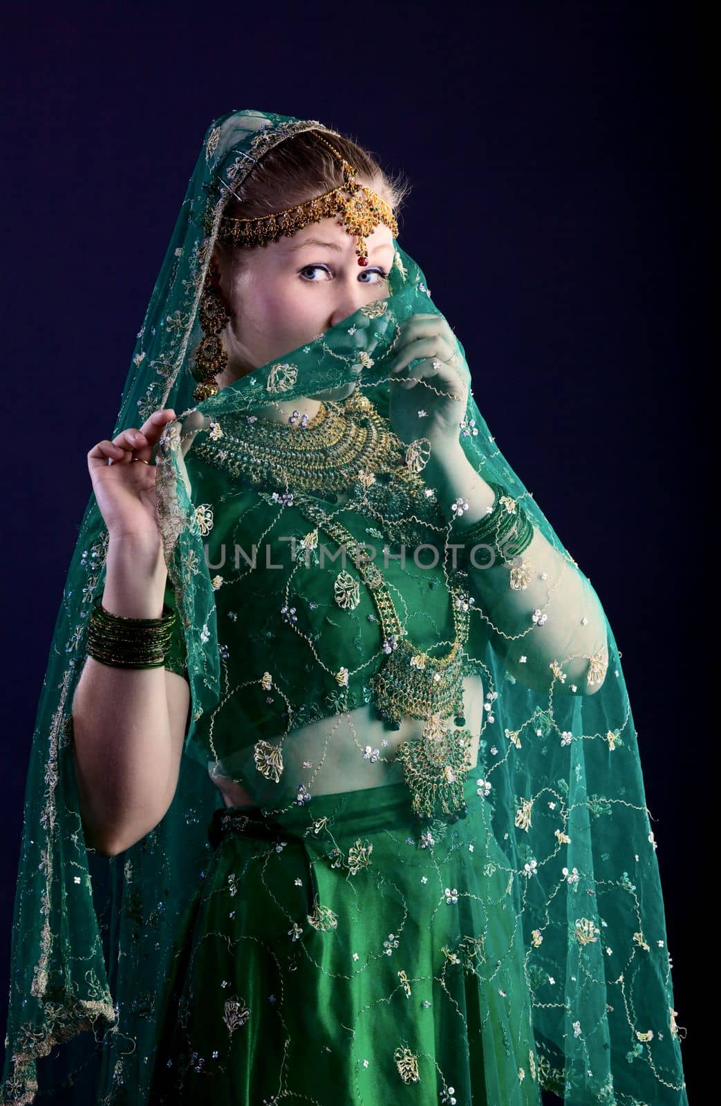 young woman look at you - close face with veil hijab
