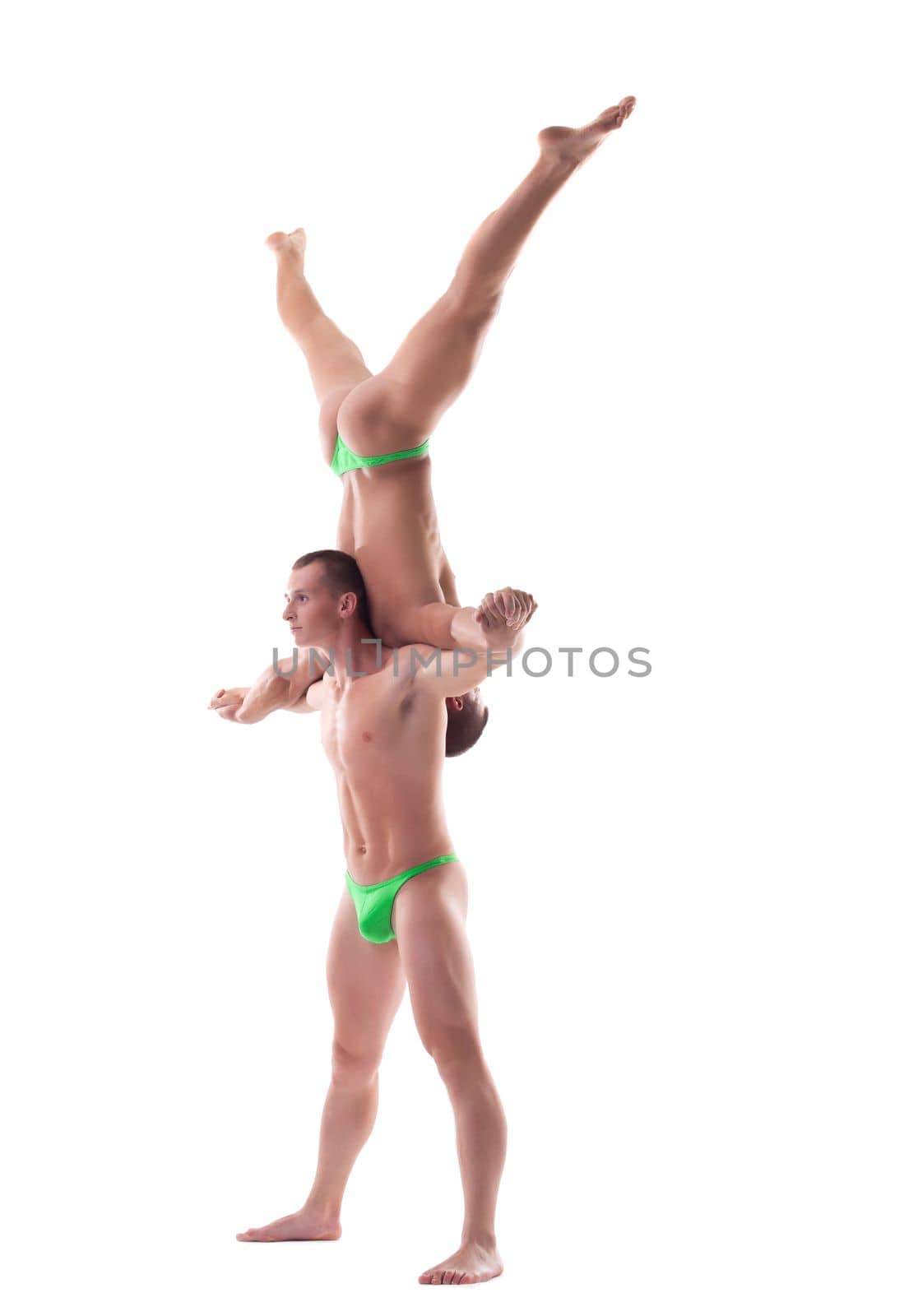 Young athletic guys show acrobatic exercise, isolated on white