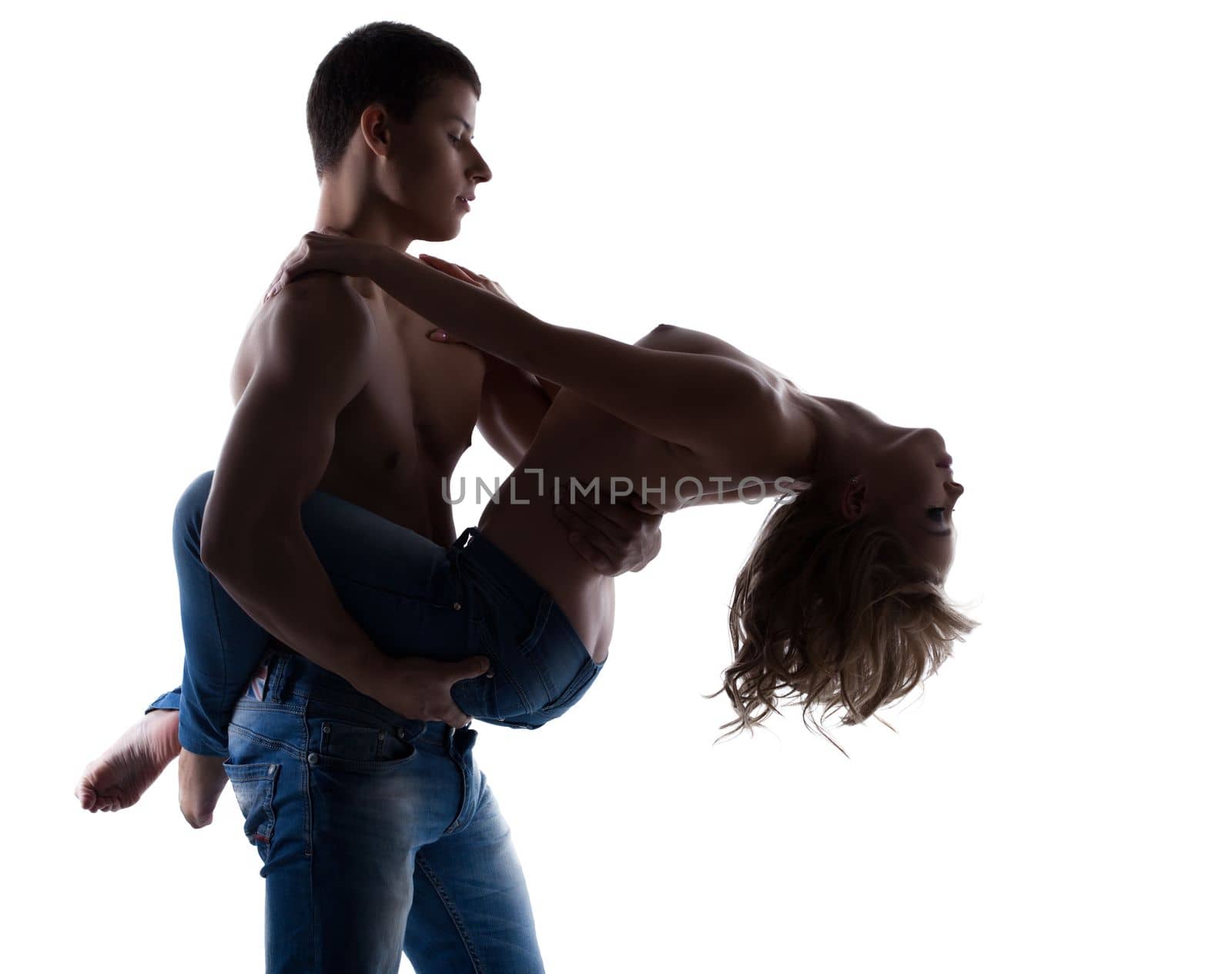 Sexy couple posing topless in jeans silhouette isolated