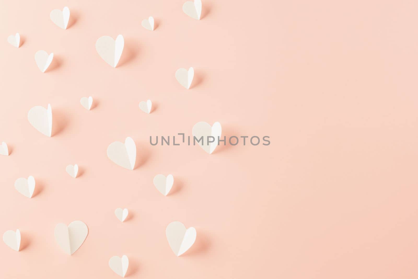 Top view flat lay of paper elements cutting white hearts shape flying on pink background, Banner template greeting card design of holiday, Love and Valentines Day background