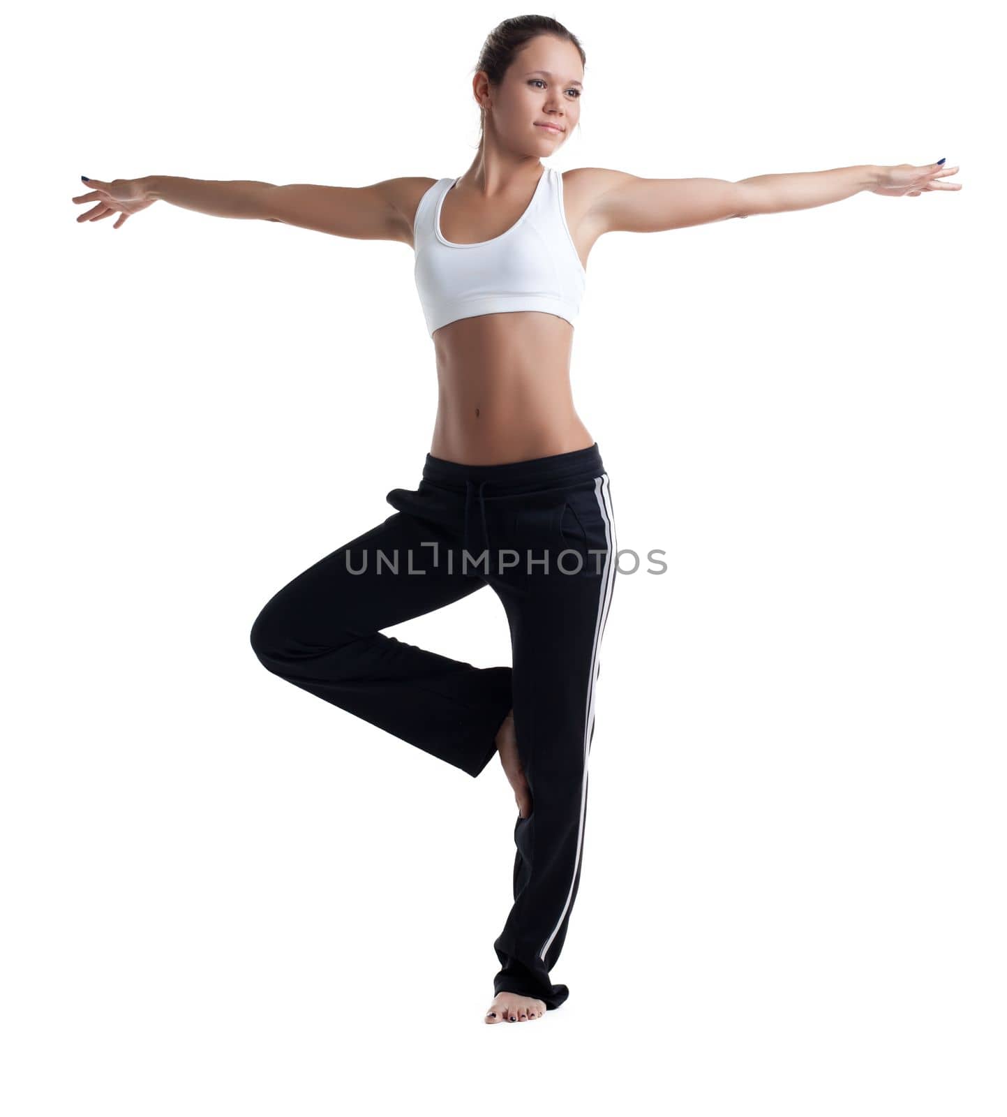 Young girl with perfect body posing in fitness costume isolated