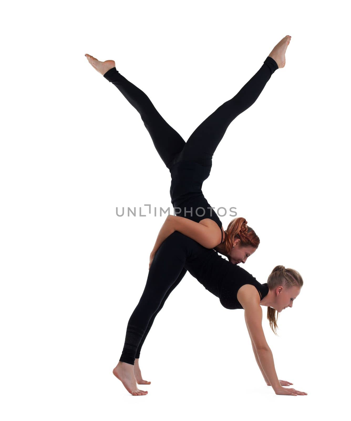 two woman gymnast in black show acrobatic exercise by rivertime